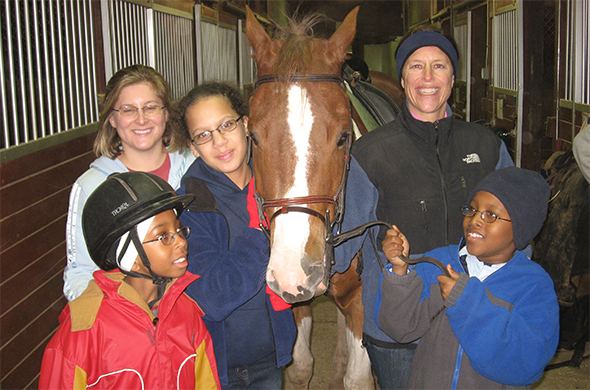 Group photo with and a horse.