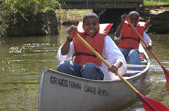 Boys in a canoe